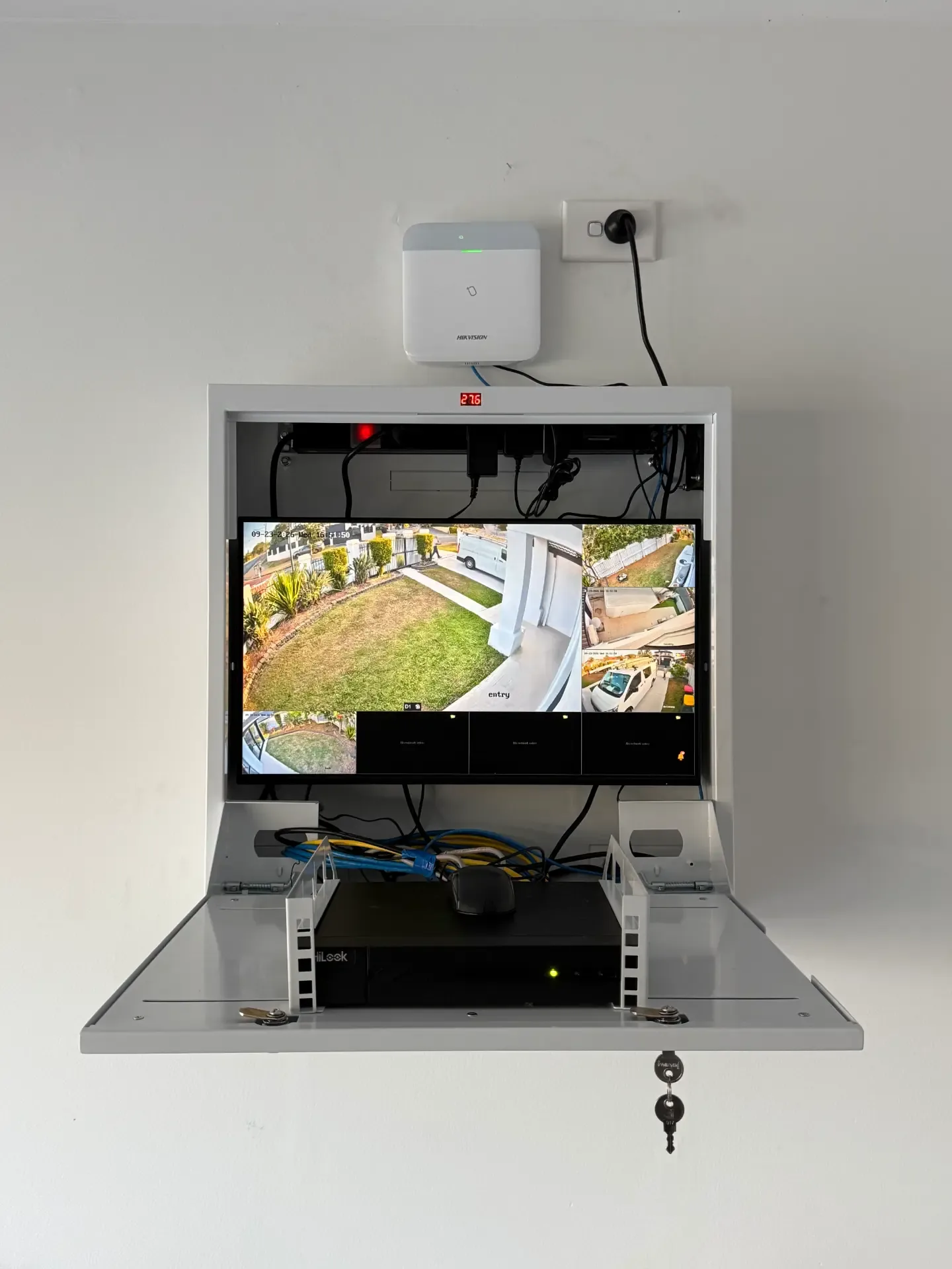 Tidy CCTV recorder cabinet with live camera view monitor